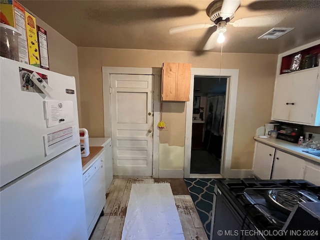 kitchen with white appliances, ceiling fan, light hardwood / wood-style flooring, and white cabinets