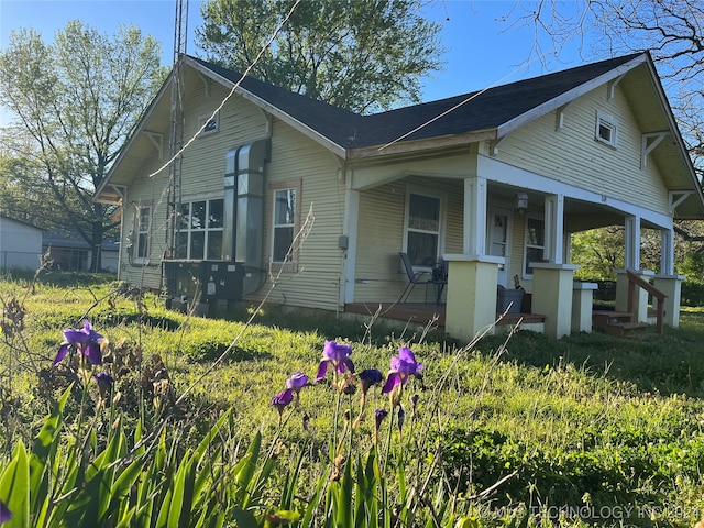 view of property exterior featuring a porch