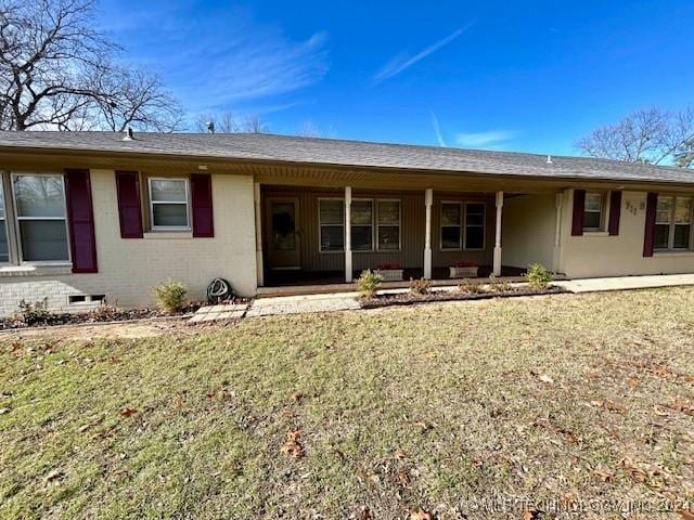 back of house with a yard