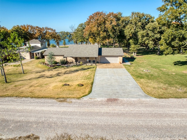 view of front of property with a garage and a front yard