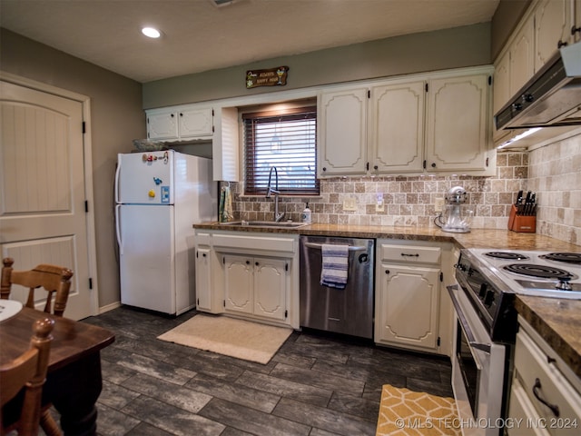 kitchen with white cabinets, white refrigerator, range with electric cooktop, stainless steel dishwasher, and sink