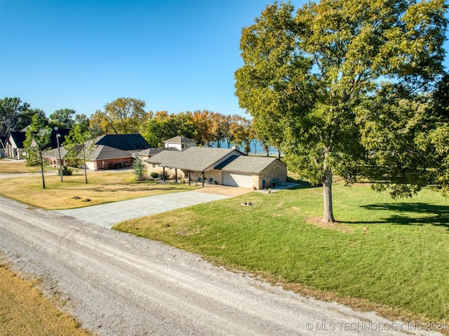 view of front facade with a front lawn and a garage