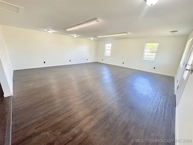 empty room featuring dark hardwood / wood-style floors