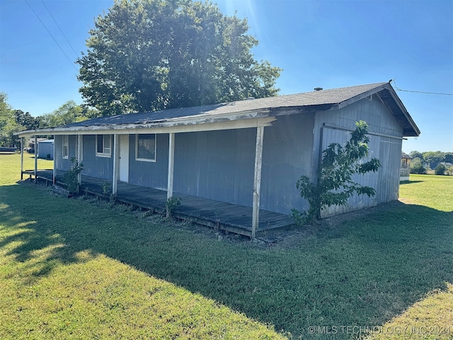 view of side of home featuring a yard