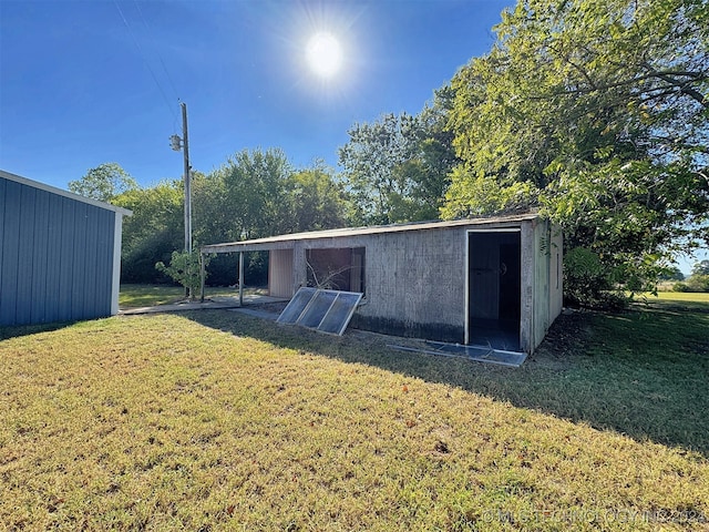 exterior space with a lawn and a shed