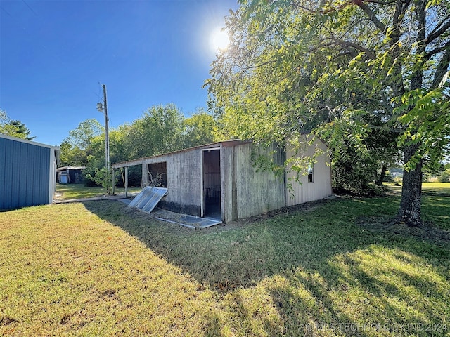 view of outdoor structure with a yard