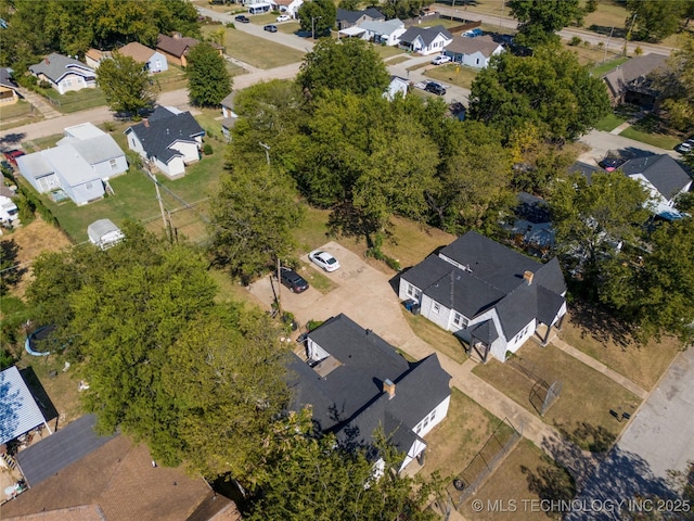 birds eye view of property with a residential view