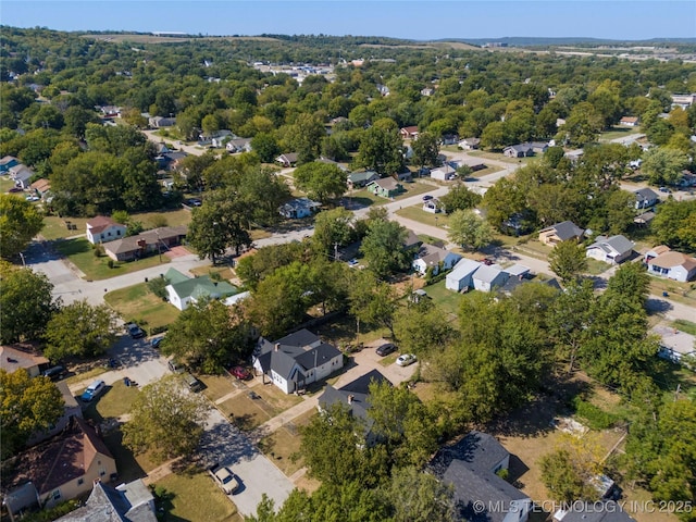 aerial view featuring a residential view and a view of trees