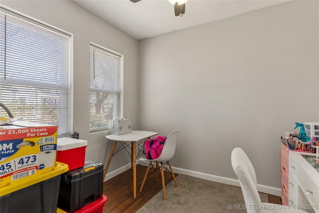 recreation room featuring wood finished floors, baseboards, and ceiling fan