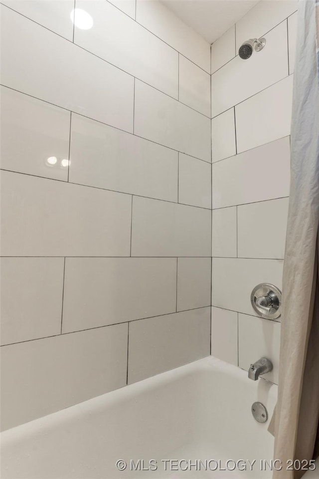 full bathroom with shower / bath combo with shower curtain