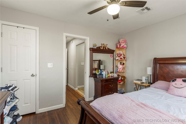 bedroom featuring visible vents, baseboards, ceiling fan, and dark wood-style flooring