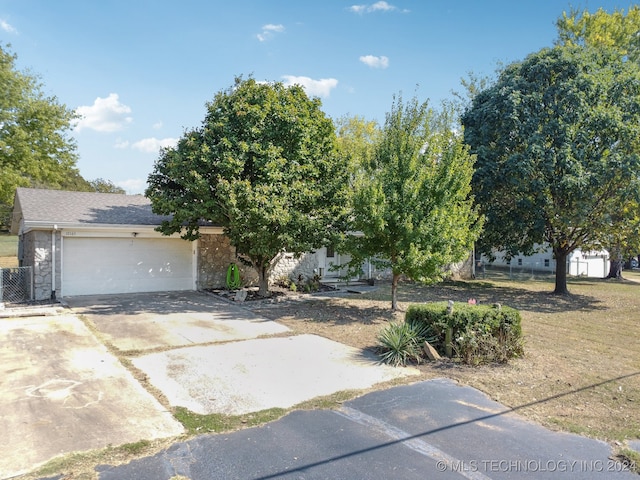 obstructed view of property featuring a garage