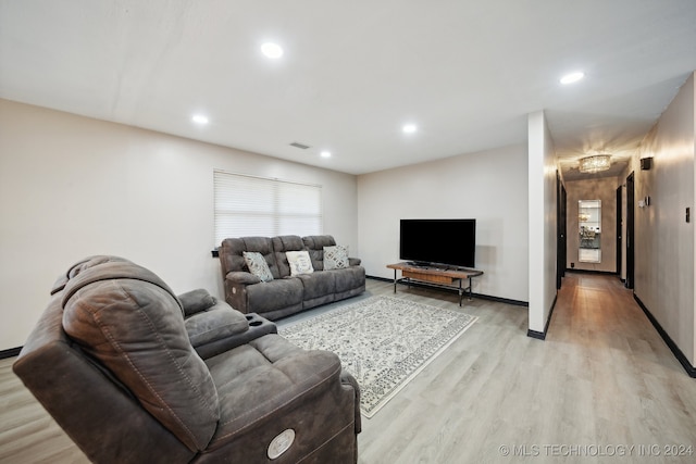 living room with light hardwood / wood-style flooring