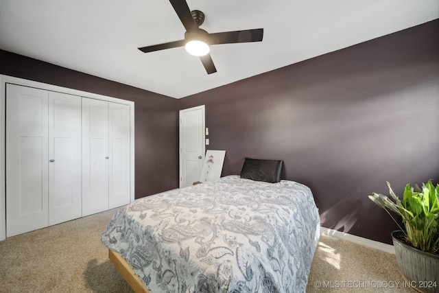 bedroom featuring ceiling fan, carpet floors, and a closet