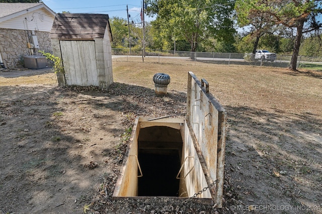 entry to storm shelter featuring central air condition unit