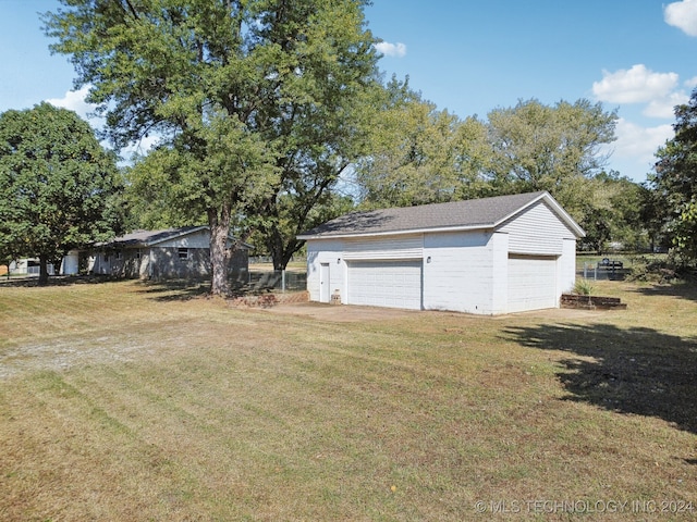 garage with a yard