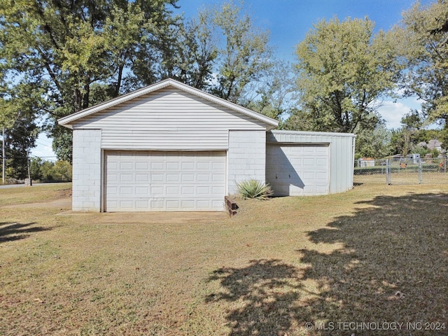 garage with a lawn