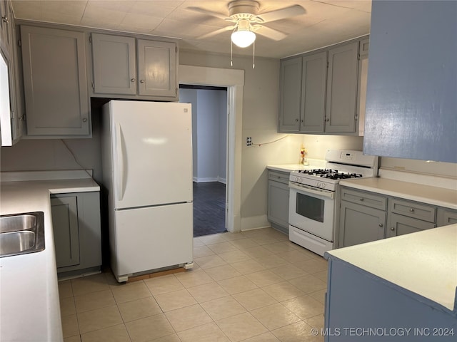 kitchen featuring ceiling fan, light tile patterned floors, white appliances, and gray cabinetry