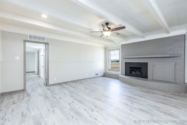 unfurnished living room featuring light hardwood / wood-style flooring, ceiling fan, and beamed ceiling