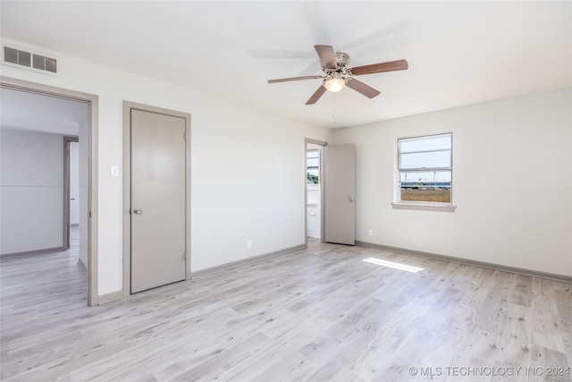 unfurnished bedroom with ceiling fan and light hardwood / wood-style floors