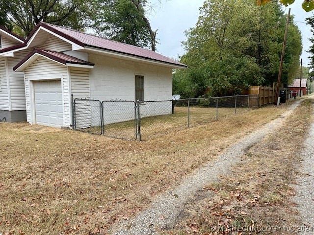 view of side of home featuring a garage