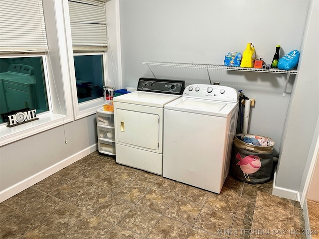 washroom featuring washer and dryer