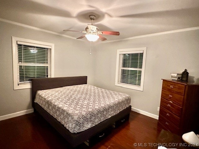 bedroom featuring ornamental molding, ceiling fan, and dark hardwood / wood-style flooring