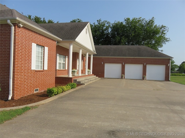 view of side of home with a garage