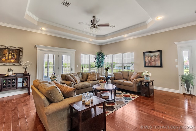 living room featuring ceiling fan, crown molding, and dark hardwood / wood-style flooring