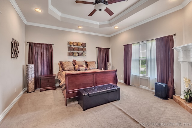 bedroom with light carpet, ceiling fan, a raised ceiling, and crown molding