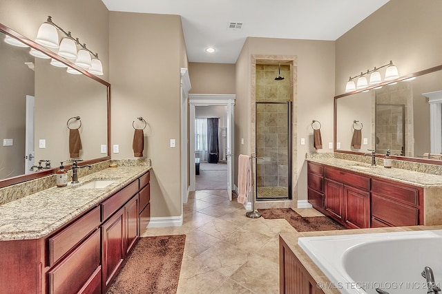 bathroom with shower with separate bathtub, tile patterned flooring, and vanity