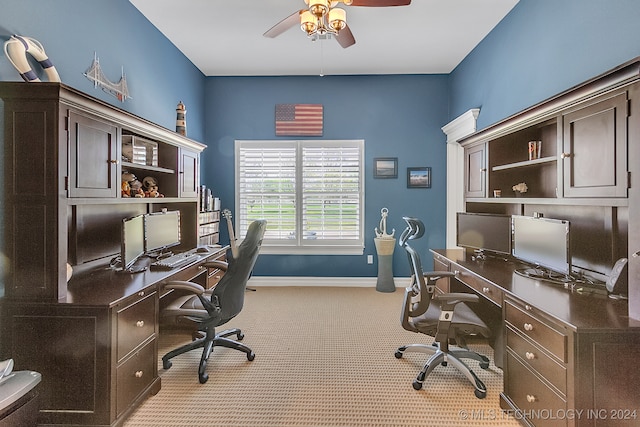 carpeted home office with ceiling fan