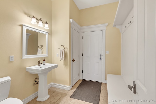 bathroom featuring toilet and tile patterned floors