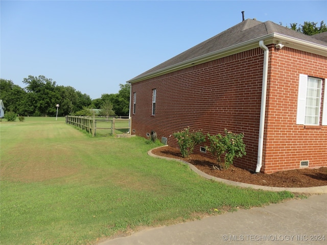 view of property exterior featuring a lawn