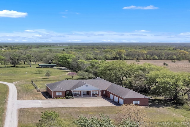 birds eye view of property with a rural view