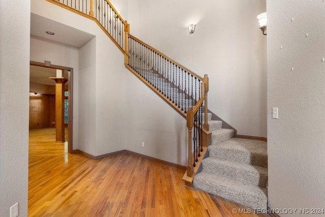 stairs with wood-type flooring