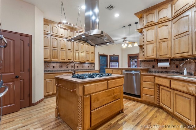 kitchen featuring island range hood, pendant lighting, a center island with sink, stainless steel dishwasher, and sink