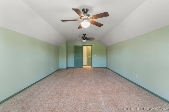 bonus room with light carpet, vaulted ceiling, and ceiling fan