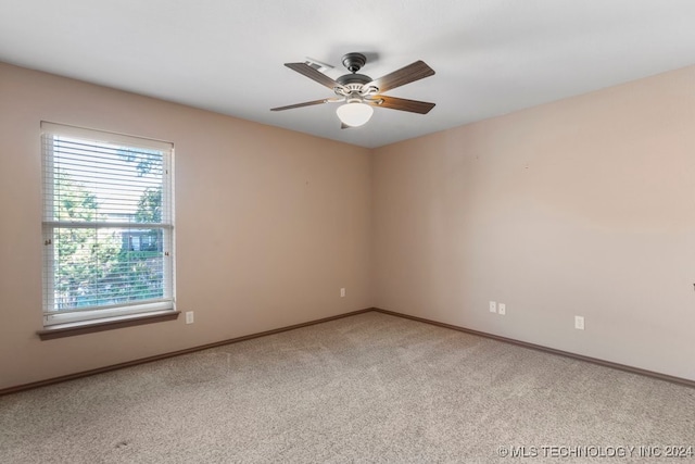 carpeted empty room with ceiling fan