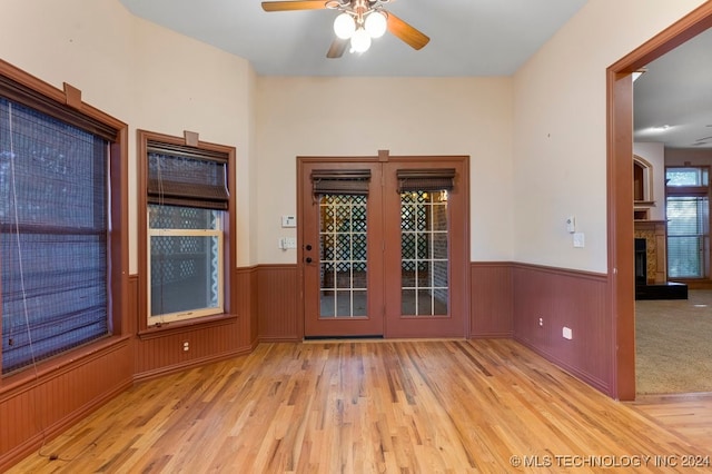 unfurnished room featuring light hardwood / wood-style floors and ceiling fan