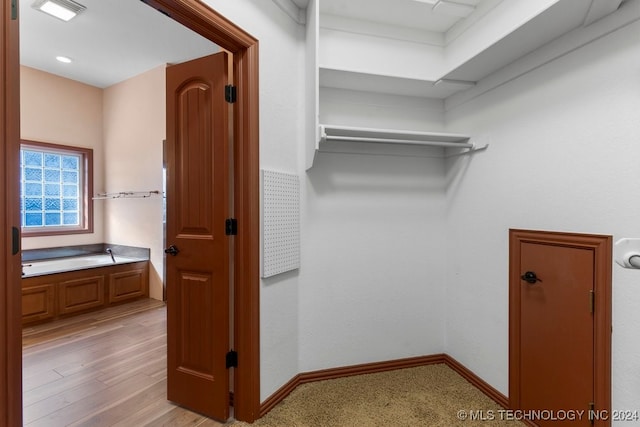 walk in closet featuring light wood-type flooring