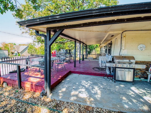 view of patio featuring a grill and a wooden deck