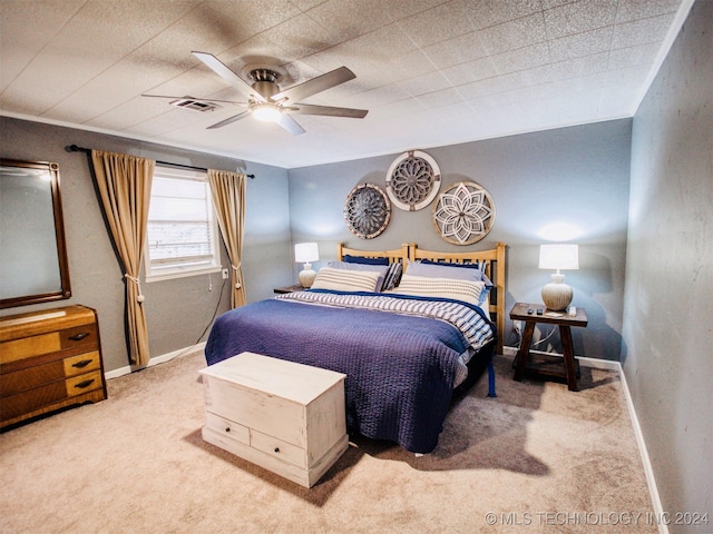 bedroom with ceiling fan and carpet