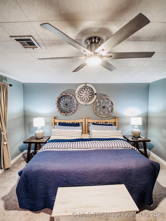 7386 Sooner Rd, Kingston, OK 73439 - carpeted bedroom with baseboards and ceiling fan