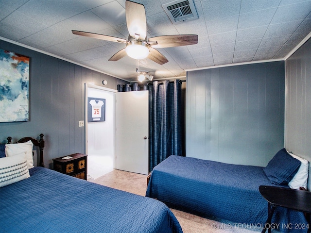 bedroom featuring crown molding, ceiling fan, and light colored carpet