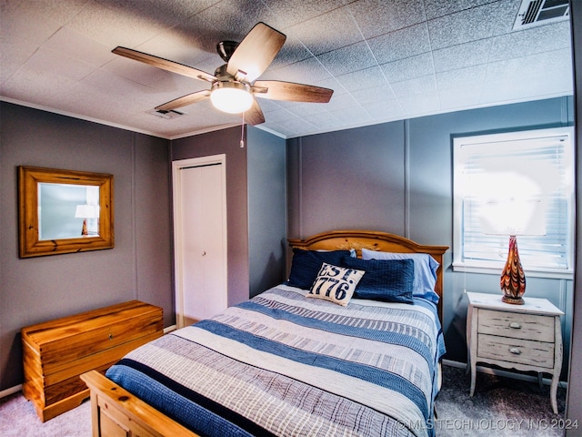 carpeted bedroom with ceiling fan