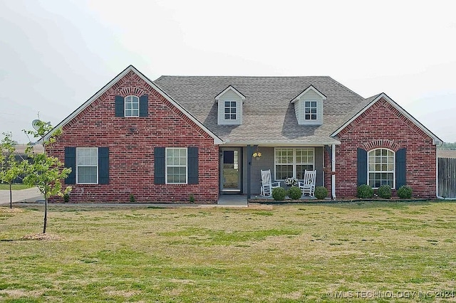 view of front of home with a front lawn and covered porch