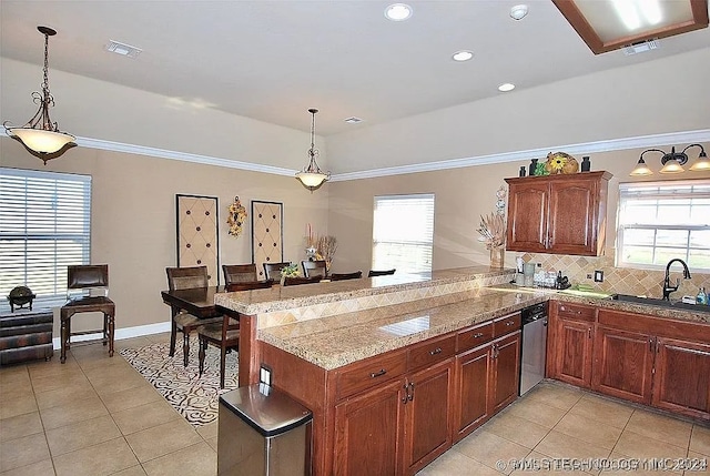 kitchen with light tile patterned flooring, hanging light fixtures, sink, tasteful backsplash, and stainless steel dishwasher