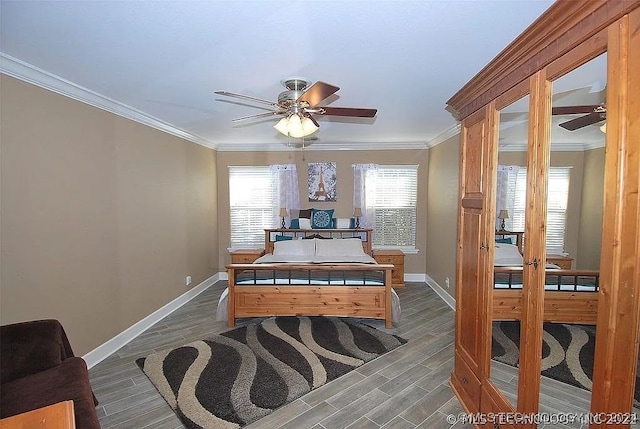 bedroom with ceiling fan, hardwood / wood-style floors, and crown molding