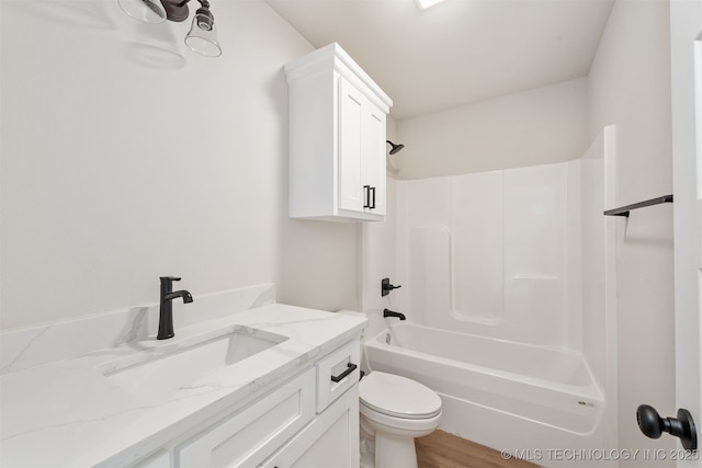 full bathroom with vanity, wood-type flooring, toilet, and shower / bathing tub combination